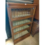Beautiful example of a Wernicke 4 tier book case with leaded glass design .