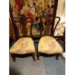 Pair of Victorian Parlour chairs with ceramic caster feet .