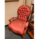 Beautiful example of a Reproduction button back arm chair .