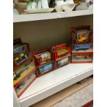 Shelf of matchbox yesteryear cars trucks etc .