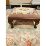 Antique queen Anne legged stool with upholstery.