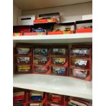 Shelf of matchbox yesteryear advertising van models.