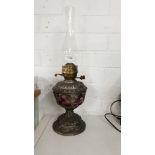 Stunning Victorian Cranberry glass oil lamp with Cast Metal base rising to brass lamp fittings
