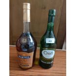 Bottle of Martel cognac together with bottle of croft sherry .