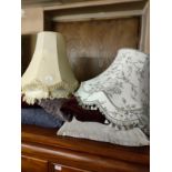 Selection of pillows and light shades .