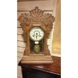 Large impressive American Gingerbread clock with pendulum stands 57 cms tall.