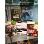 Shelf of xbox related items includes call duty game set , boxed kinnect etc.