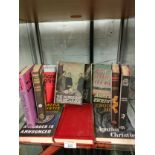 Large Shelf of Agatha Christie books.