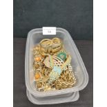 Box of gold tone jewellery.