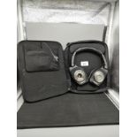 Denon head sets in fitted case.