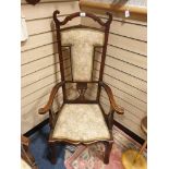 Large antique arm chair with unusual design set with silk upholstery.