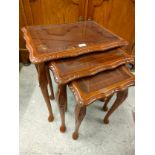 Rosewood style Nest of 3 tables with glass inserts.