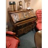 Antique carved ornate carved bureau .