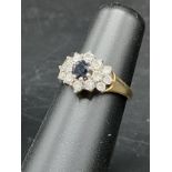 9ct gold sapphire and clear stone ring .
