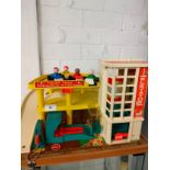 Vintage 1980s fisher price toy parking ramp toy with elevator with original cars.