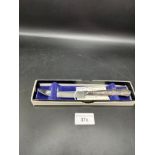 Sterling silver handled knife in kings pattern with original box . By Harris brothers .