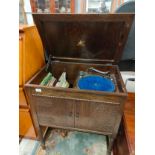 1900s Sylaphone cabinet with turn table in need to attention together with records .