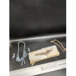 Lot of pocket watch chains together with diamonte necklace and earring set .