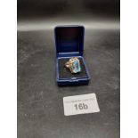 333 hall marked gold ring with large blue set stone . 7 grams .