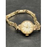 9ct gold cased watch on a 12ct rolled gold bracelet.