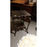 19th century ornate 2 tier window table with scalloped edged .