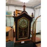 19th century ornate clock with Barrell pendulum.