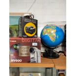 Boxed digital camera , globe together with other item.