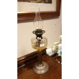 Large Victorian oil Lamp With Glass reservoir and glass funnel by Turner Duplex .