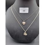 2 silver chain with heart shaped silver pendant s .