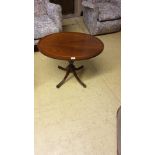 Beautiful little Oval Topped inlaid Tri Lag Table With Dainty Brass Lion Paw Casters .