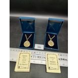 2 Boxed 6 pence pendant necklaces .