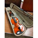 Violin with bow in fitted case.