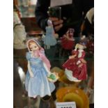 2 small royal doulton figures .