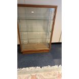 Early 1900s shop display cabinet with glass shelfs and sliding glass doors height 128 cms length