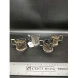 Set of 4 1900s metal coffee cup holders.