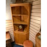 Ercol blonde wood 3 tier cabinet fitted with storage cupboard .