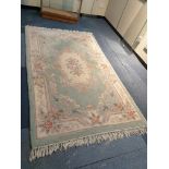 Large Oriental rug measuring 154 cms by 260 cms.