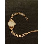 9ct gold ladies wrist watch with 9ct gold bracelet. 13 grams gross weight .