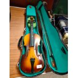 Violin with bow in fitted case.