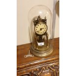 Large Victorian Glass Domed Brass Dome clock with revolving pendulum and key winds and revolving