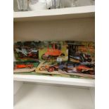 Shelf of Vintage classic car table place mats.