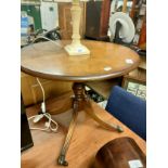 Antique style table with caster feet .