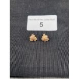 Pair of 10k hall marked gold leaf earrings .