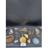 3 ornate necklaces with beautiful owl pendant etc and a selection of stunning brooches etc.