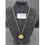 9ct gold 375 hall marked pendant on yellow metal un marked chain .