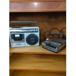 Sanyo radio together with tape deck player .