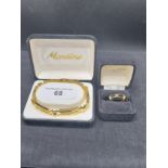 Good quality Montine gate bracelet and black and gold enamel Napier ring.