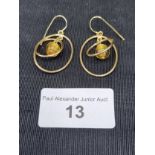 Pair of heavy usual 9ct gold earrings amber style setting .