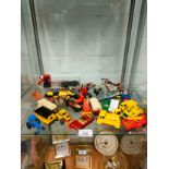 Shelf of playworn vehicles.