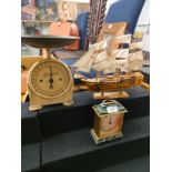 Vintage scales , victory boat model together with clock .